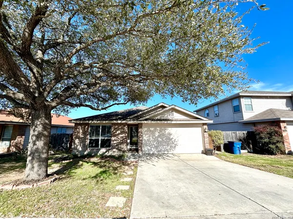 a front view of a house with a yard and porch