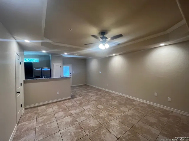 a view of a hallway with a kitchen