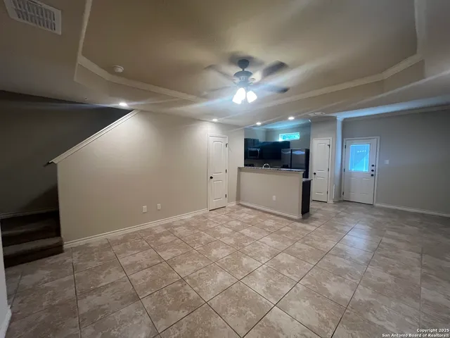 a view of a livingroom with a kitchen