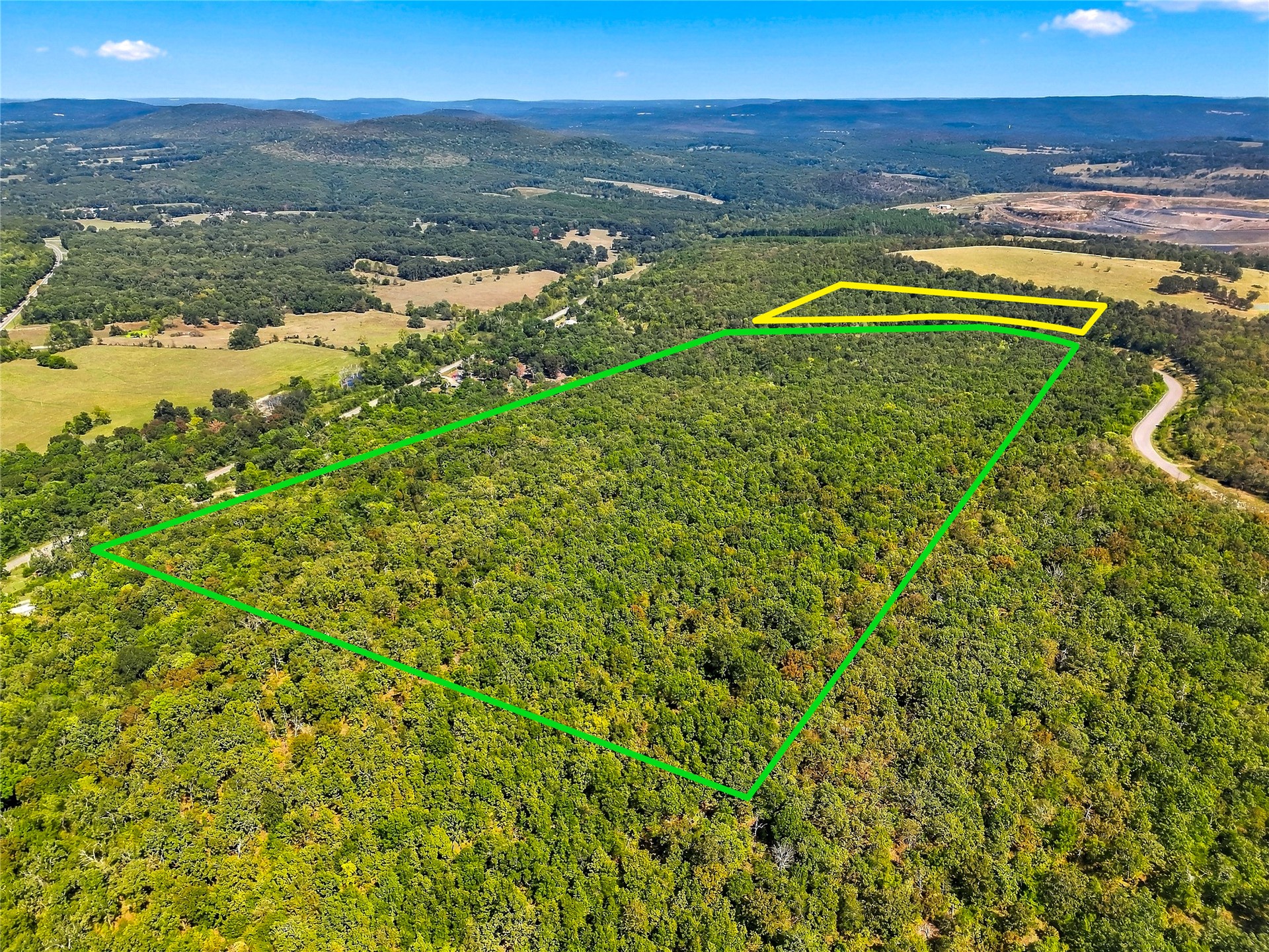 90333 South 4697 Road Stilwell, OK 74960 - Photo 16 of 26 Expansive wooded acreage with a winding road bordering the property