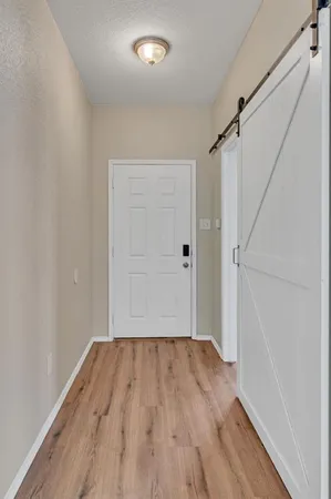 a view of room with wooden floor