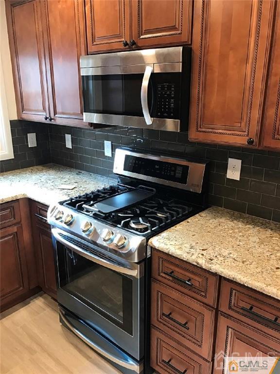 10 Longview Road Old Bridge, NJ 08857 - Photo 3 of 10 a kitchen with stainless steel appliances granite countertop a stove and a microwave