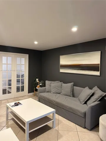 a living room with furniture and windows