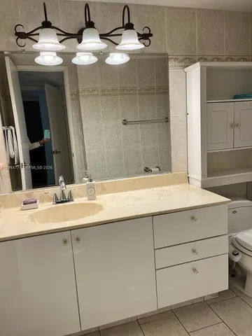 a view of a garden with sitting area