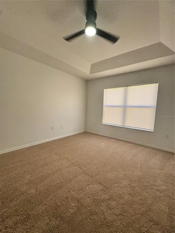 an empty room with a empty space and windows