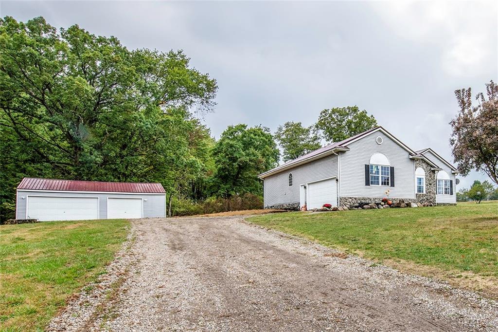 716 Rutledge Road Transfer, PA 16154 - Photo 16 of 17 a house view with a garden space