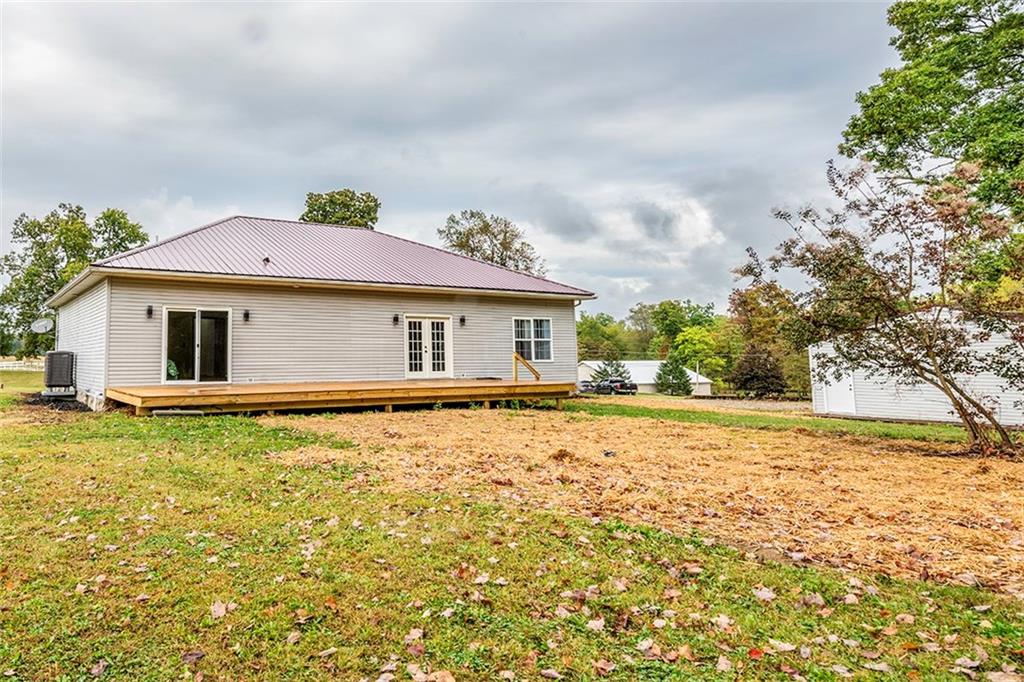 716 Rutledge Road Transfer, PA 16154 - Photo 17 of 17 a backyard of a house with table and chairs