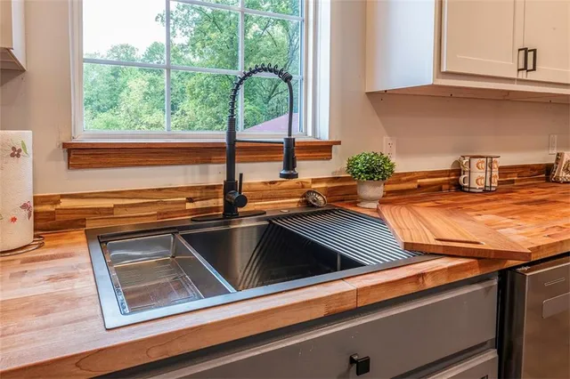 a kitchen with a sink and a window
