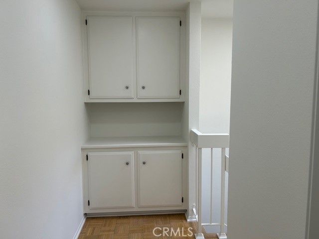 a view of an empty room with closet area