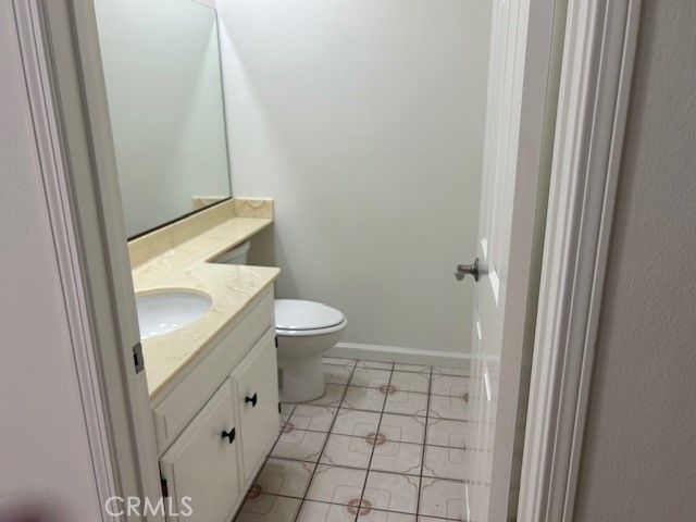a bathroom with a sink and toilet