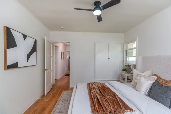 a bed room with a bed and a walk in closet