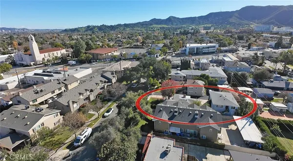 an aerial view of a house with a garden