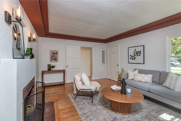 a living room with furniture and a table