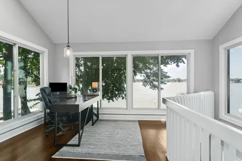 a view of a dining room with furniture window and outside view