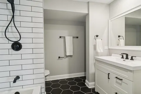 a bathroom with a sink and shower