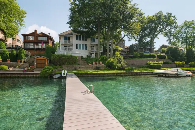 a view of a lake with a house in the background