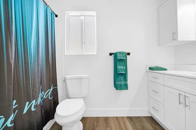 a bathroom with a sink a mirror and vanity