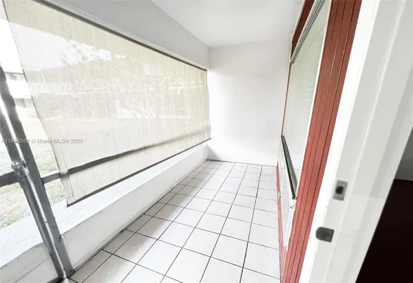 a view of an empty room and window