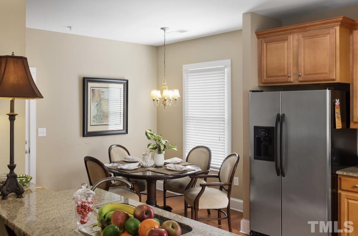 613 West Cabarrus Street, Unit 202 Raleigh, NC 27603 - Photo 13 of 17 a view of a dining room with furniture