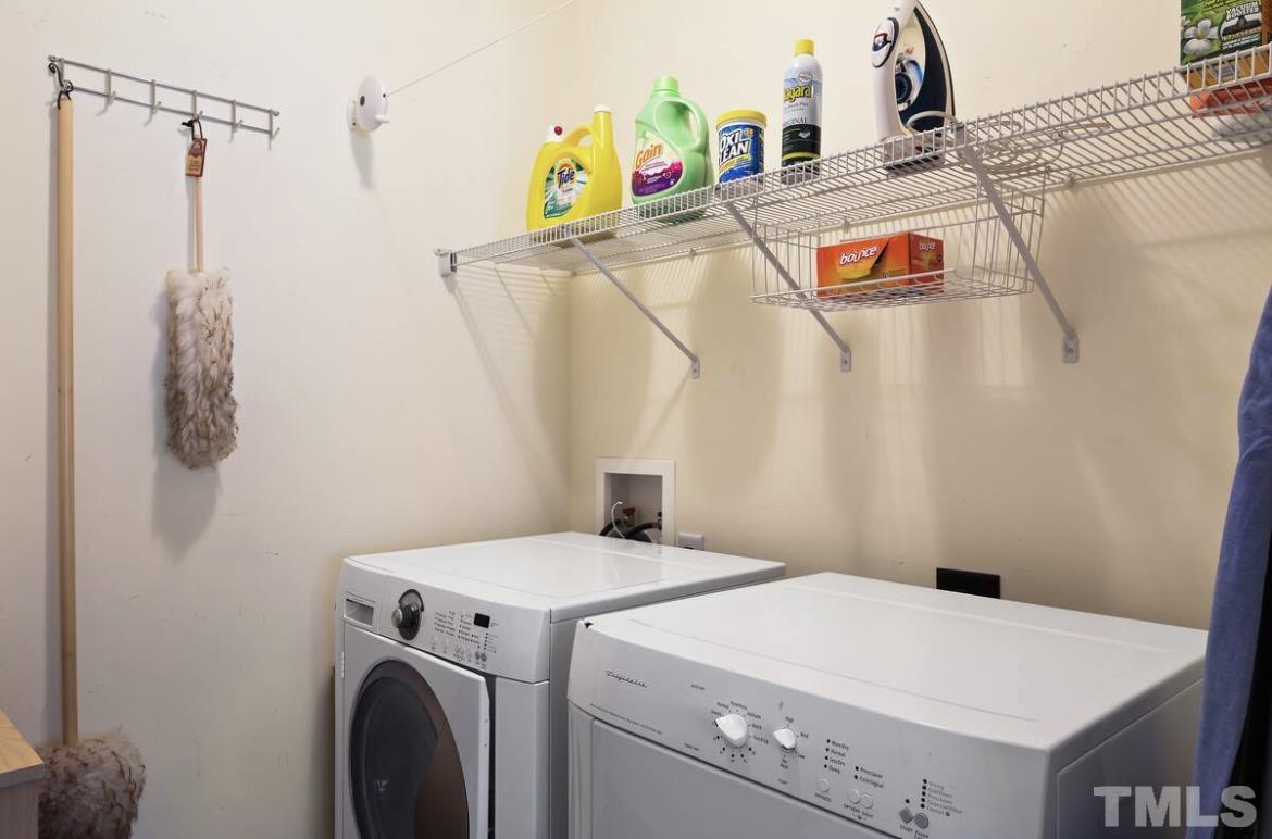 613 West Cabarrus Street, Unit 202 Raleigh, NC 27603 - Photo 15 of 17 a utility room with dryer and washer