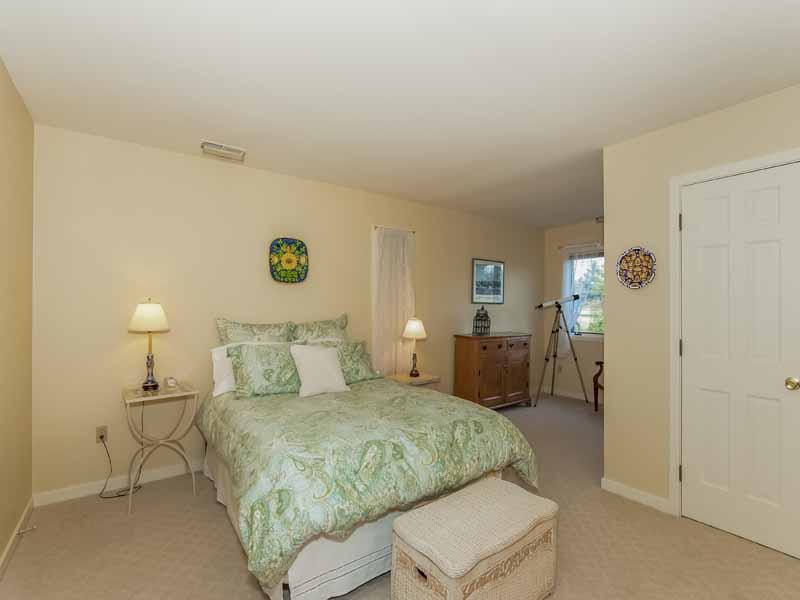 12 Ridge Farms Road Norwalk, CT 06850 - Photo 11 of 23 a bedroom with a bed and a lamp