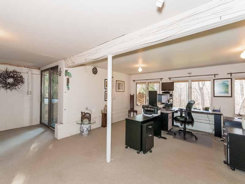 12 Ridge Farms Road Norwalk, CT 06850 - Photo 14 of 23 a view of a livingroom with furniture and a large window