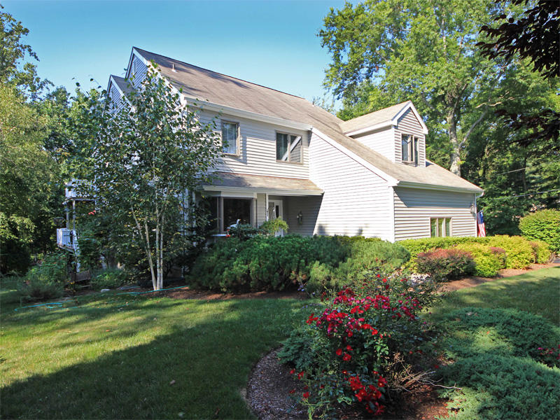 12 Ridge Farms Road Norwalk, CT 06850 - Photo 17 of 23 a front view of house with a garden