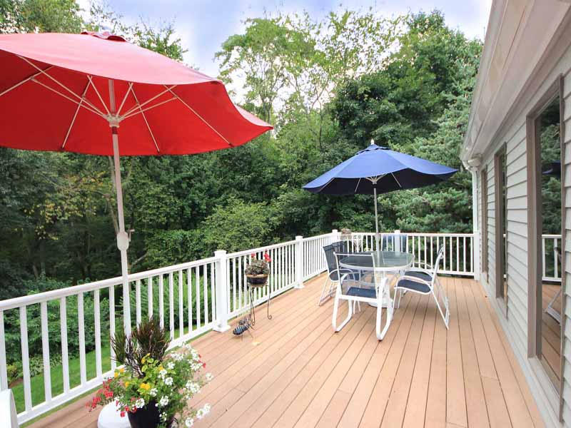 12 Ridge Farms Road Norwalk, CT 06850 - Photo 18 of 23 a view of balcony with outdoor seating and wooden floor