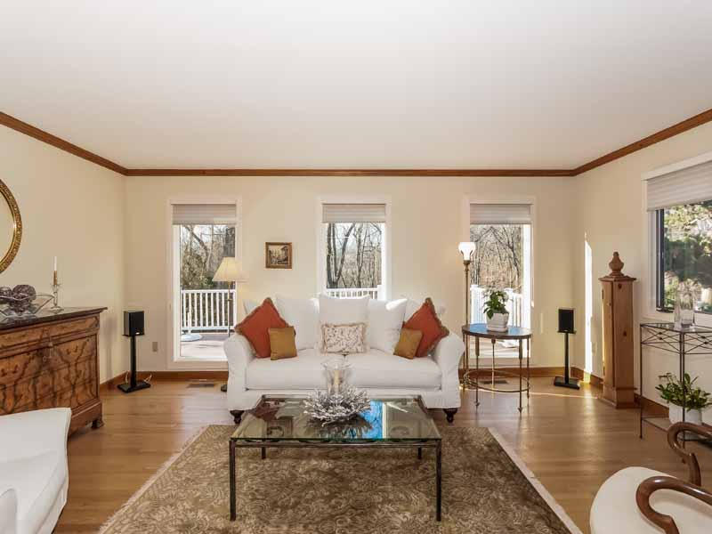 12 Ridge Farms Road Norwalk, CT 06850 - Photo 2 of 23 a living room with furniture couches and a dining table with wooden floor
