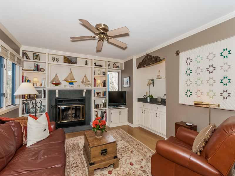 12 Ridge Farms Road Norwalk, CT 06850 - Photo 6 of 23 a living room with furniture a flat screen tv and a fireplace