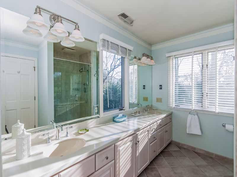 12 Ridge Farms Road Norwalk, CT 06850 - Photo 9 of 23 a spacious bathroom with a granite countertop sink mirror and a shower