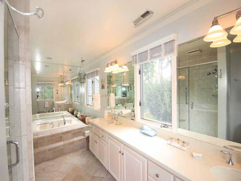 12 Ridge Farms Road Norwalk, CT 06850 - Photo 10 of 23 a spacious bathroom with a bathtub shower sink and mirror
