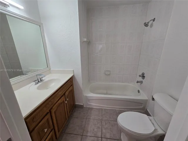 a bathroom with a sink a toilet and bathtub