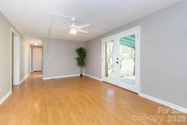 a view of an empty room with a window