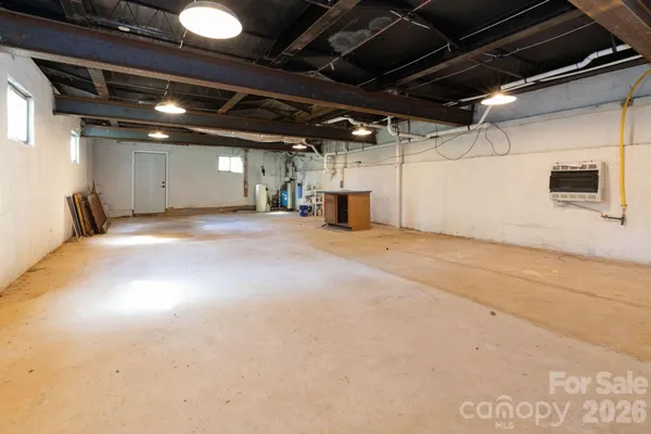 a view of an empty room with a garage