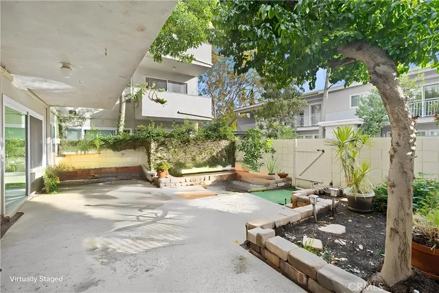 a view of a chairs and fire pit in the patio yard