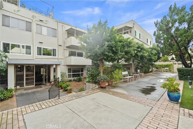 a view of a building with sitting area