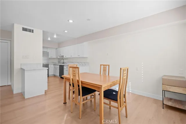 a view of kitchen with furniture and wooden floor