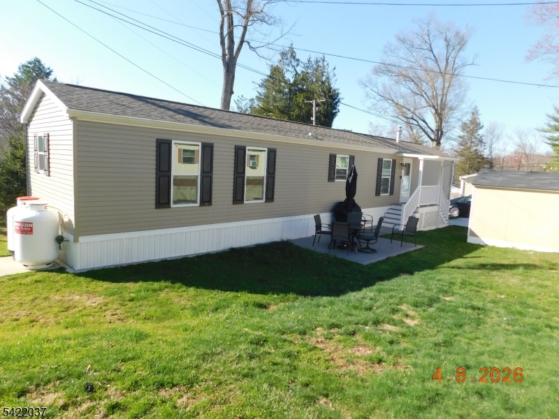 a front view of house with yard and patio