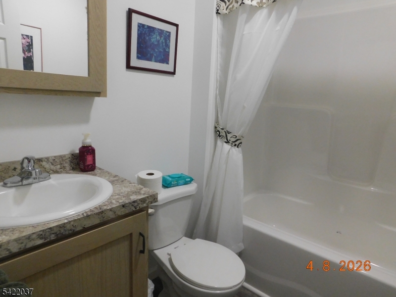 89 Back Street Oxford, NJ 07863 - Photo 13 of 17 a bathroom with a granite countertop sink mirror vanity and toilet