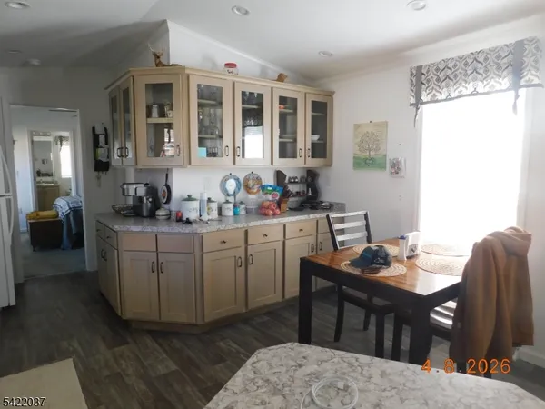 a kitchen that has a sink and chair