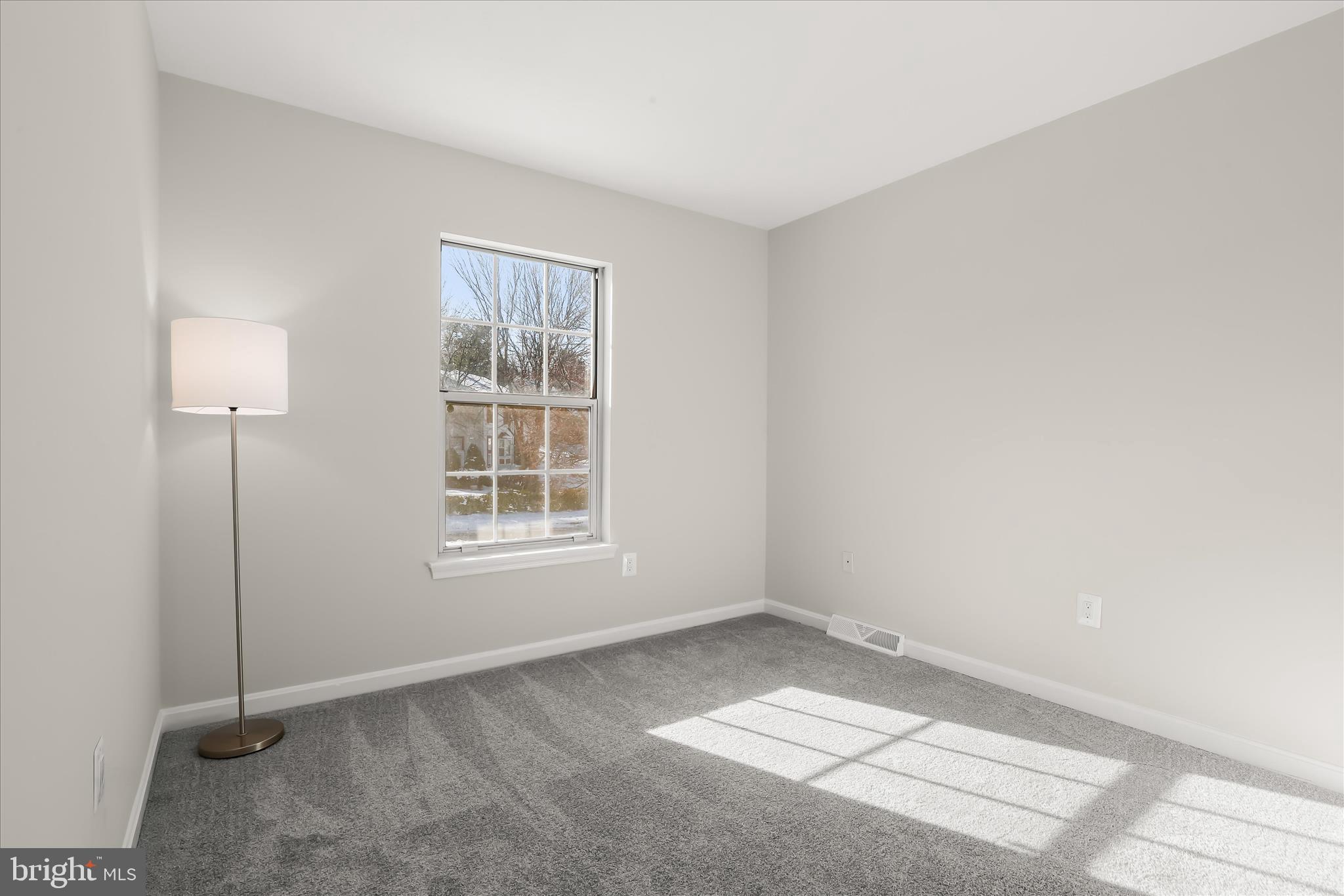 893 Century Street Hampstead, MD 21074 - Photo 20 of 42 a view of an empty room with a window