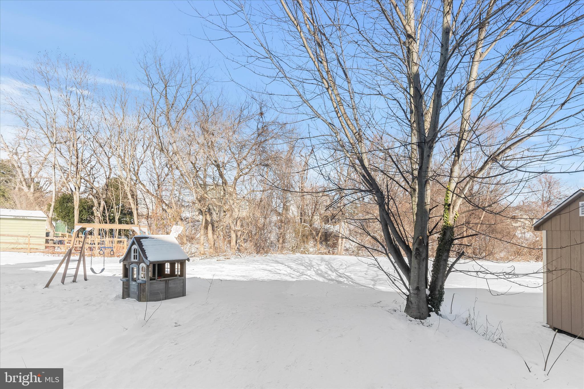 893 Century Street Hampstead, MD 21074 - Photo 32 of 42 a wooden bench sitting in middle of snow