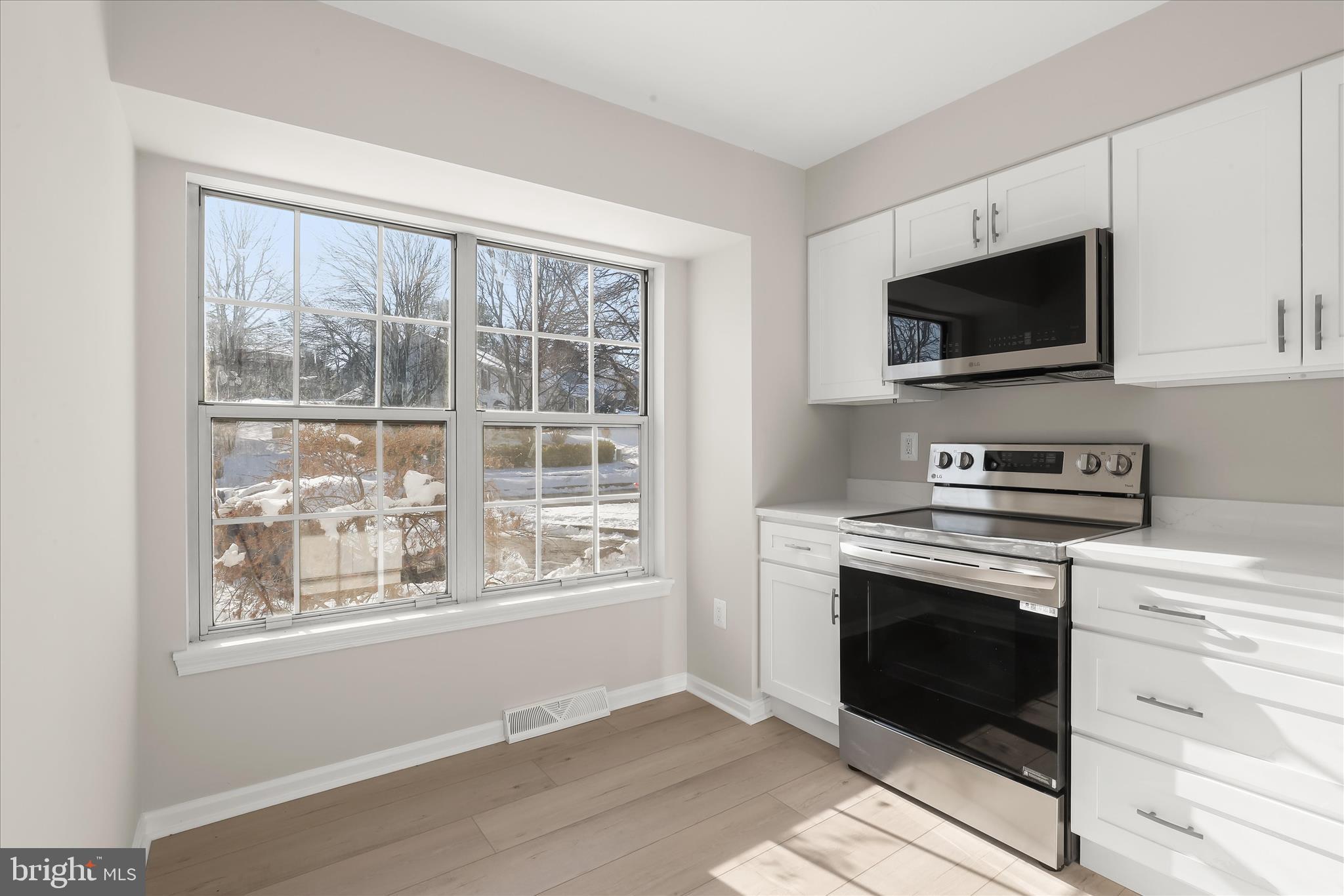 893 Century Street Hampstead, MD 21074 - Photo 4 of 42 a view of kitchen with cabinets and fireplace
