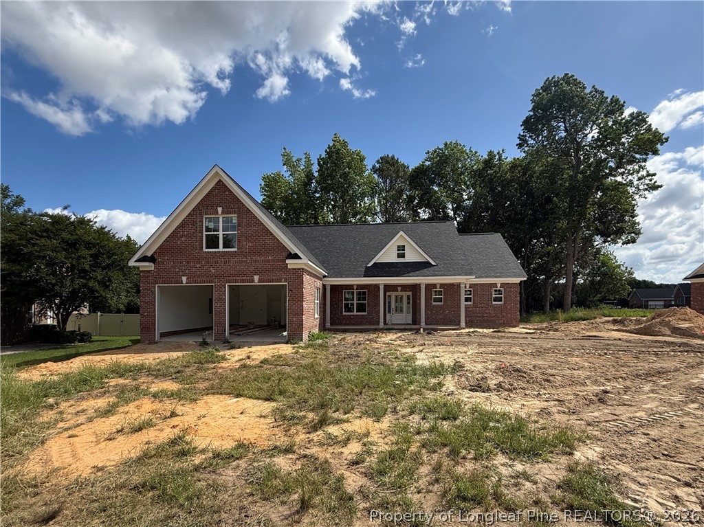 154 Ridge Stone Drive Autryville, NC 28318 - Photo 1 of 17 a front view of a house with a yard