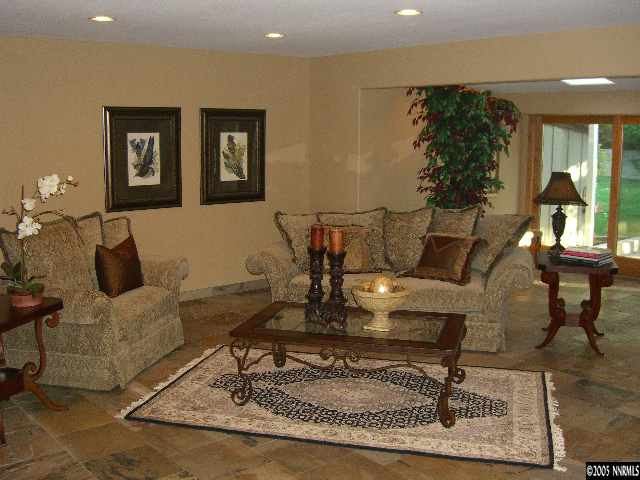 3450 Quilici Road Reno, NV 89511 - Photo 4 of 8 a living room with furniture and a rug