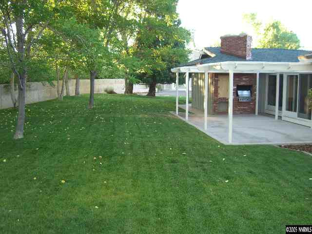 3450 Quilici Road Reno, NV 89511 - Photo 7 of 8 a view of a house with a yard and sitting area