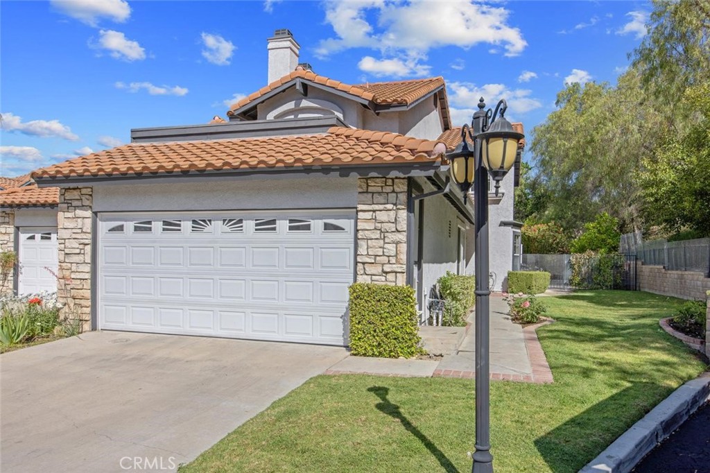 5974 Ruthwood Drive Calabasas, CA 91302 - Photo 1 of 30 a front view of a house with garden