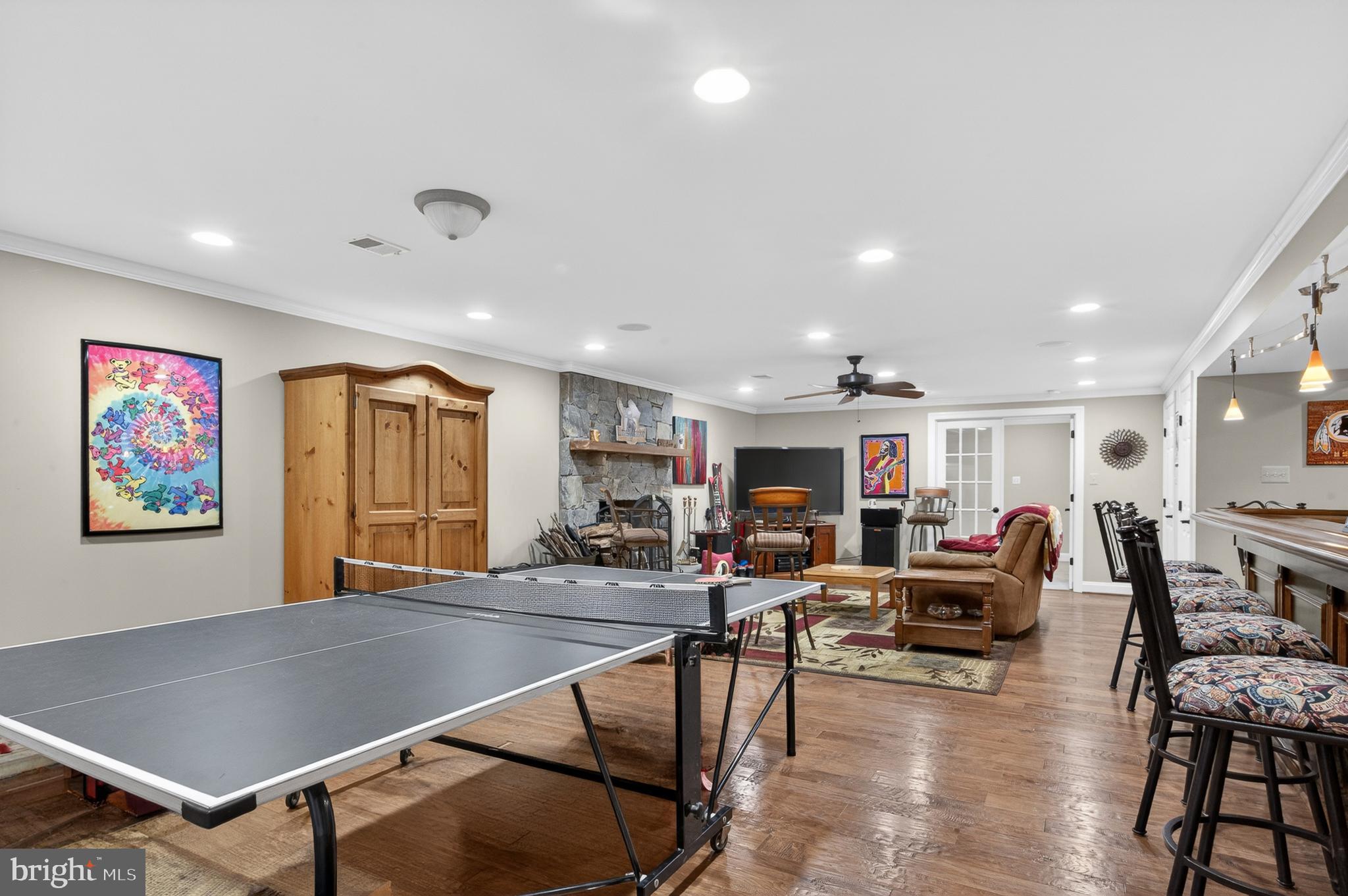 6601 Colchester Road Fairfax Station, VA 22039 - Photo 56 of 78 a living room with furniture a table and kitchen view