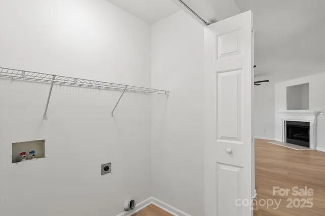 a view of a storage & utility room with wooden floor